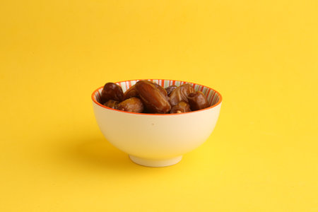 The delicious and sweet dried date palm fruits in the bowl