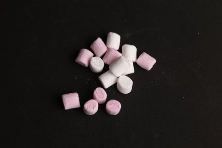 A group of marshmallows isolated on black background