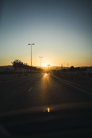 A vertical shot of a highway in Jerez de la Frontera, southern Spain at sunset viewed from the car