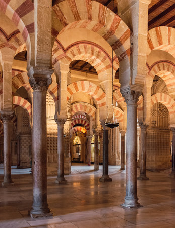 A vertical shot of the beautiful interior of the Mosque of Cordoba located in Andalusia, Spainの写真素材