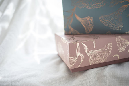 Two decorative present boxes on white backgroundの写真素材