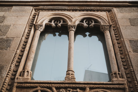 A closeup shot of a window of an old building with architectural details in Lamego City, Portugal
