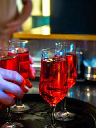 A vertical shot of red cocktails at a barの写真素材