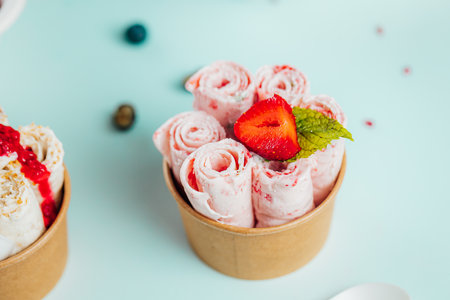 A closeup shot  of the strawberry ice cream rolls in the container