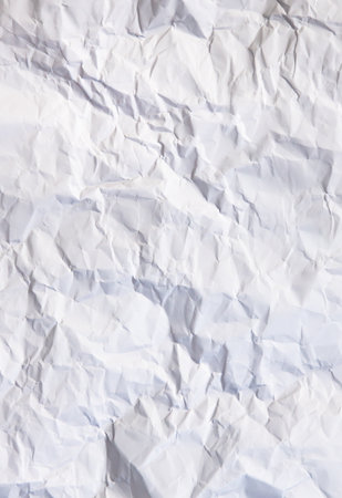 A crumpled page of white paper, foruse as a backgroundの写真素材