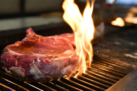 The process of making a delicious steak on a grillの写真素材