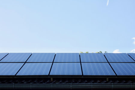 A high angle shot of PV solar panels on the roof of a building