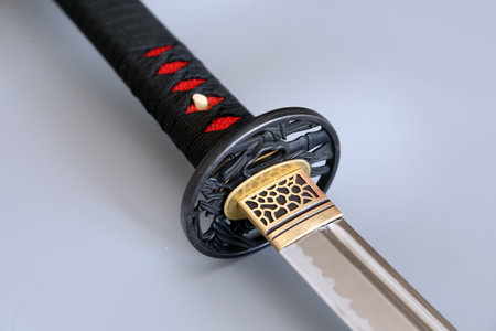 A closeup shot of a traditional Japenese katana sword handle