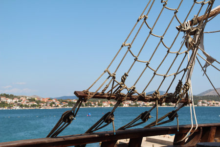 A rope ladder on a pirate ship against a blue sky