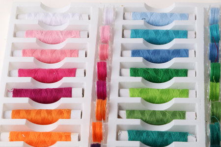 A closeup shot of multicolor threads in a thread box