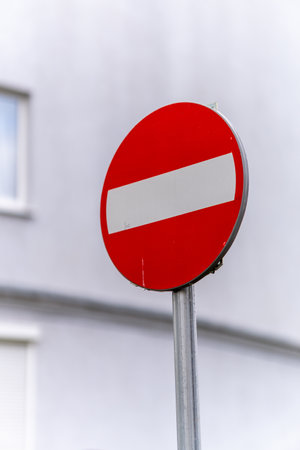 A vertical selective focus shot of a road stop sign