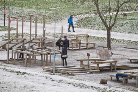 STOCKHOLM, SWEDEN - Dec 25, 2020: Stockholm, Sweden - December 25 2020 : People working out in the outdoor gym in Tantolunden on a snowy and cold Christmas dayのeditorial素材
