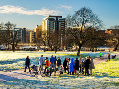 STOCKHOLM, SWEDEN - Dec 24, 2020: Stockholm, Sweden - December 24 2020 : People celebrating Christmas in the park to avoid  risking to spread the corona virusのeditorial素材