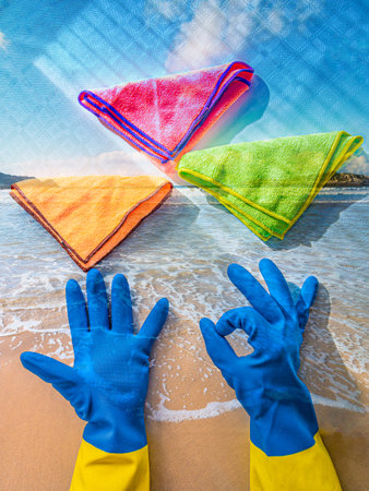 Blue gloves showing OK gesture next to microfibres - concept of cleaning