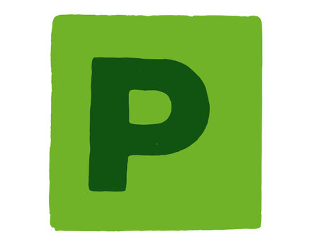 An alphabet letter cube with capital letter P on a green backgroundの写真素材