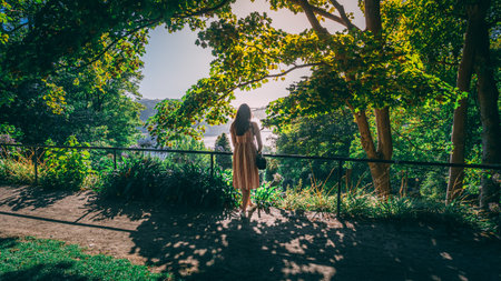 A beautiful shot of a female in the gardens of Palacio de Cristal in Porto, Portugalの写真素材