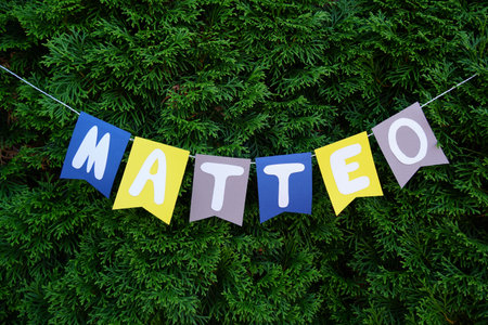 A closeup shot of a birthday banner with the name Matteo on it