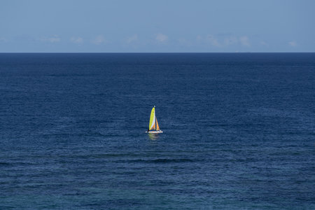 An aerial shot of a sailing boat in the seaの写真素材