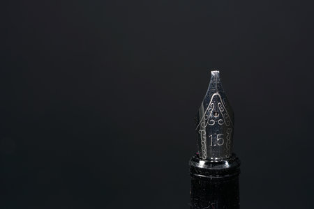 A closeup shot of a fountain pen on a grey backgroundの写真素材