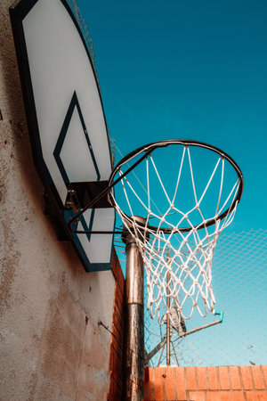 A vertical low angle shot of basketball hoopの写真素材