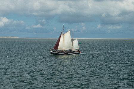 A high angle shot of a sailing boat in the seaの写真素材