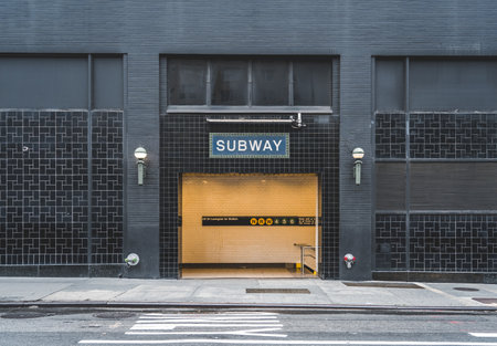 A subway sign on a metro entrance in New Yorkの写真素材