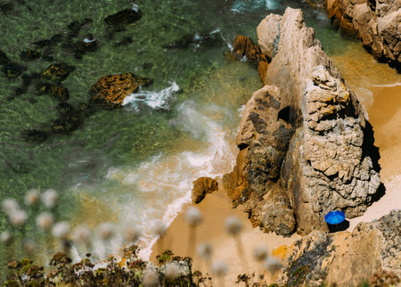 A high angle shot of big rock formations on the coast of the seaの写真素材