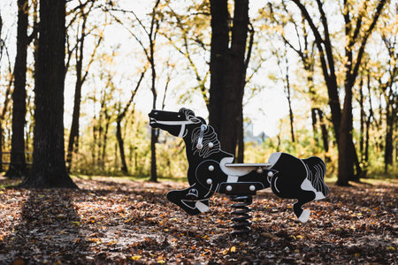 A selective focus shot of roking horse toy in the parkの写真素材