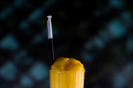 A closeup shot of a yellow smoothie