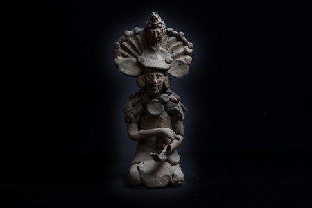 A closeup of reproduction of a small Mayan sculpture from the island of Jaina, Mexico