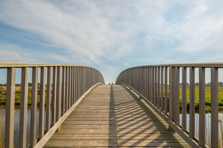 A beautiful shot of a bridge over a river on a clear sky backgroundの写真素材