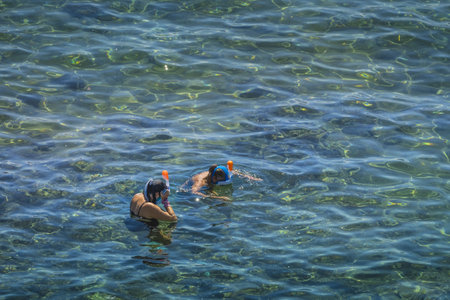 A high angle shot of people enjoying their day in the seaの写真素材