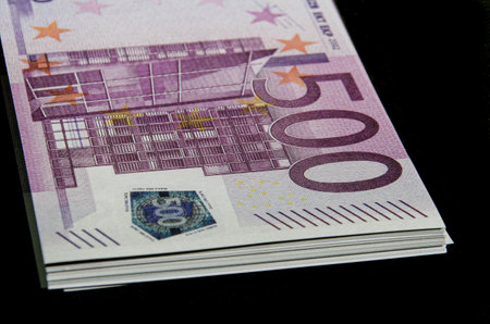 A closeup shot of a 500 euro banknote on a black surfaceの写真素材