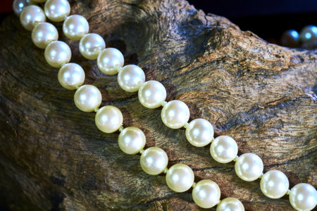 A closeup shot of natural pearls on a stone surfaceの写真素材