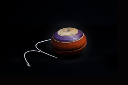 A closeup shot of a wooden trompo used on the day of the dead