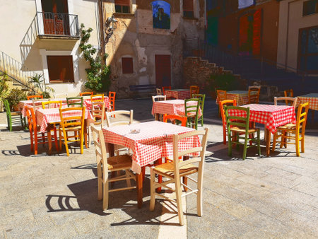 A view of tables and chairs set up in Pisciotta, Italyの写真素材