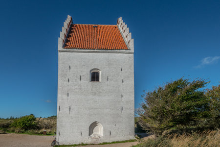A beautiful shot of a Den Tilsandede Kirke's building  in Skagen, Denmarkzの写真素材