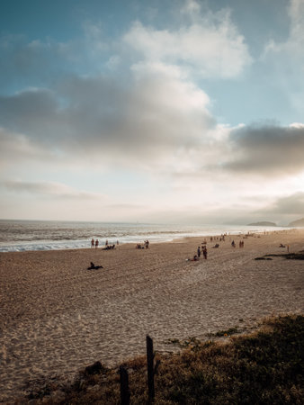 A vertical shot of a sandy beach in Rio, Brazil on a cloudy dayの写真素材