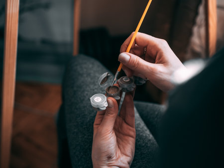 An artist getting pain on the brush
