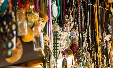 Fashion stand with costume jewellery and simple pendants and chains made of leather and silver.の写真素材