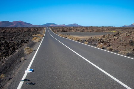 A mesmerizing shot of road to Timanfaya National Park in Spainの写真素材