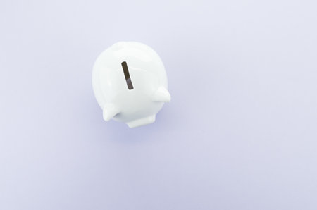 A high angle shot of a white piggy bankの写真素材