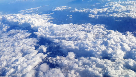 A beautiful scenery of the earth and white clouds seen from a plane