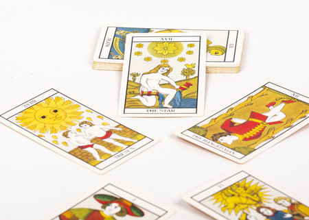 A deck of tarot cards on a tableの写真素材
