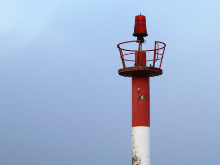 A closeup of the tip of a lighthouseの写真素材