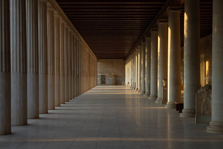 A beautiful view of the columns of The Stoa of Attalos in Athens, Greece with rays of sunlightの写真素材