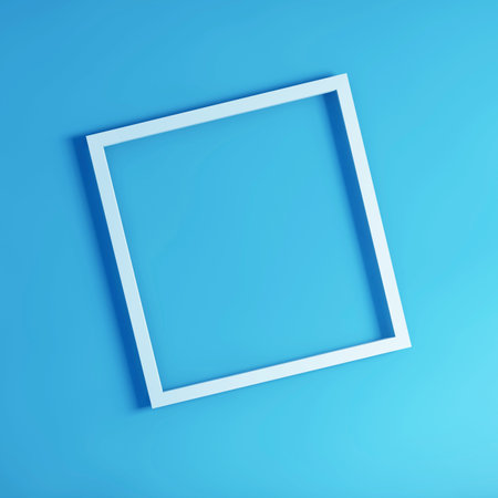 A top view shot of a white frame board on a light blue backgroundの写真素材
