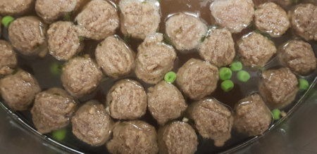 Traditional Hungarian liver dumpling soup made with lot of vegetables