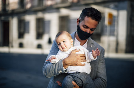 A Caucasian father holding her baby girlの写真素材