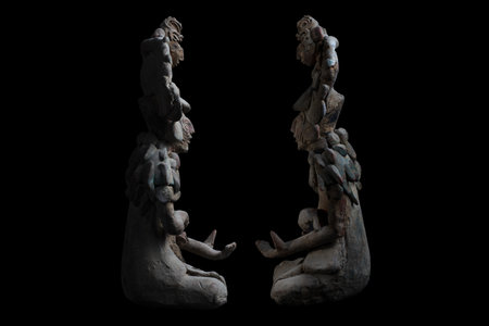 Historic clay-made Mayan sculptures of ancient shamans of Jaina island isolated on a black backgroundの写真素材